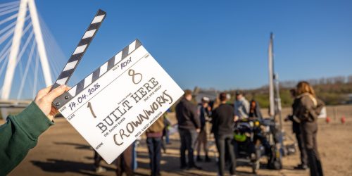 Film clapper board in front of a scene on the Crown Works site in Sunderland.