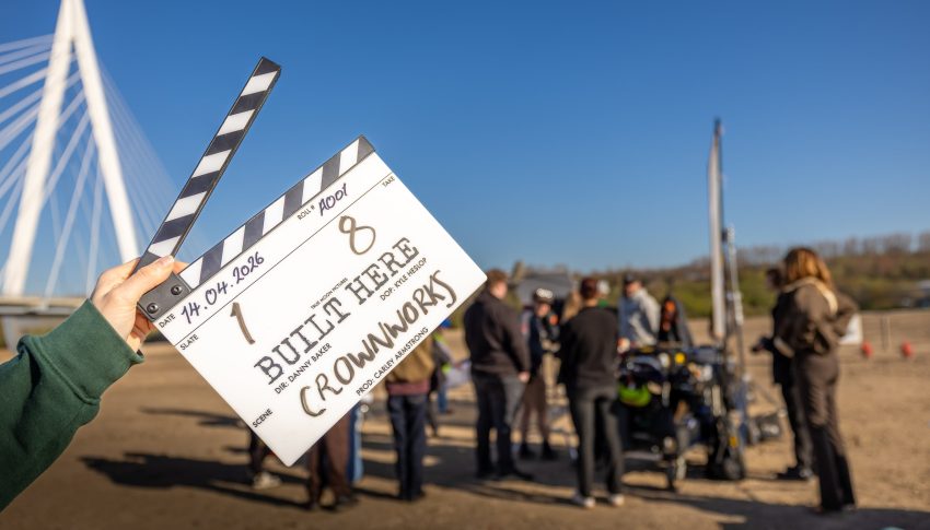 Film clapper board in front of a scene on the Crown Works site in Sunderland.